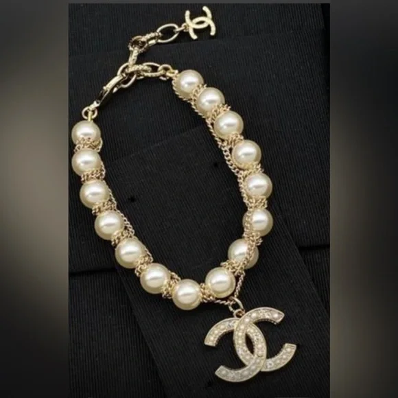 Gold-Tone Pearl Bracelet with Crystallized Logo Pendant - Picture 1 of 7